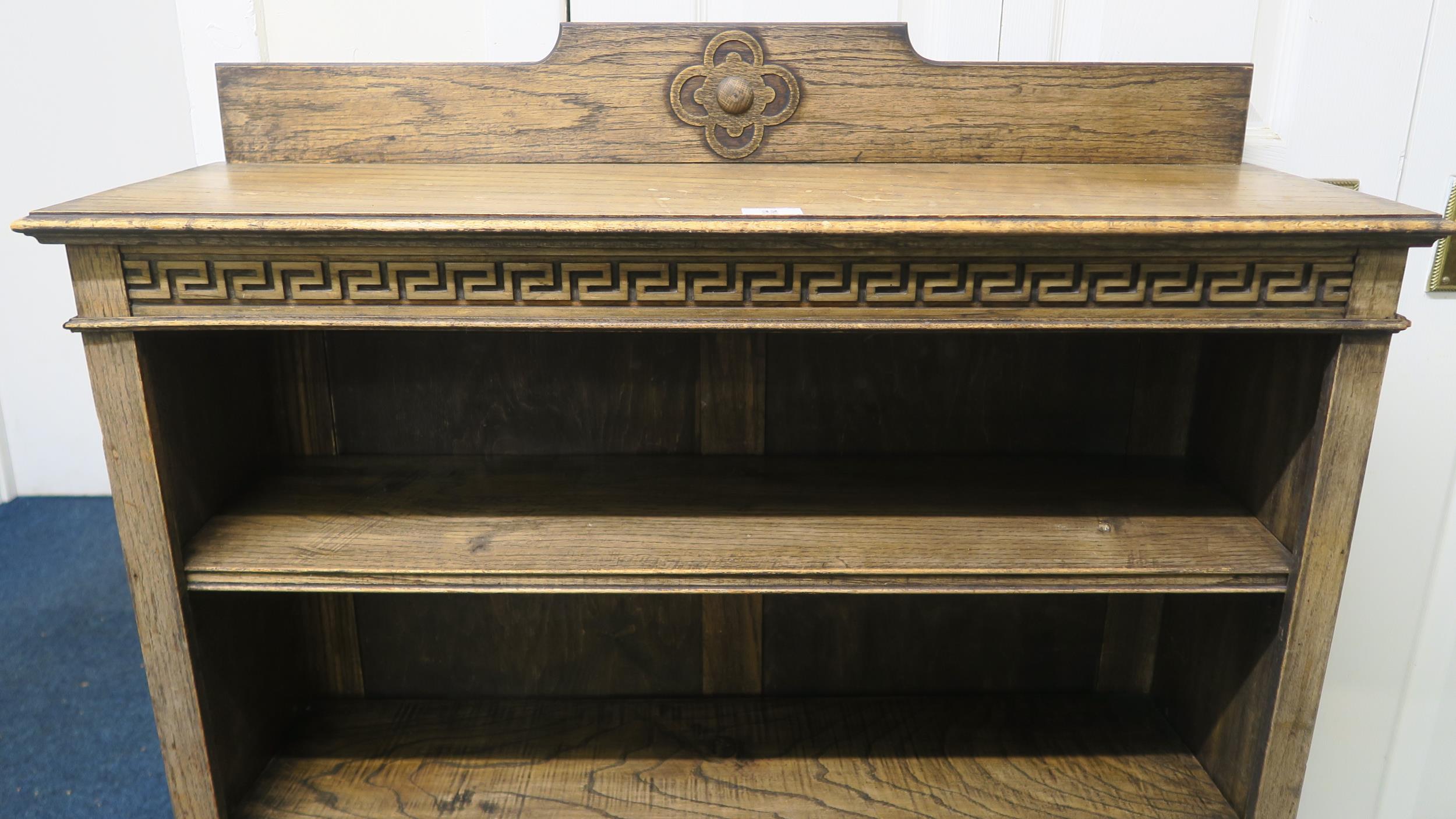 A 20th century oak three tier open bookcase with Grecian key design, 103cm high x 91cm wide x 27cm - Image 2 of 5