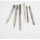 A collection of white metal propelling pencils, including Parker, Dupont, Eversharp, a silver