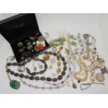 A string of smoky quartz beads, and bracelet, a silver sovereign case and other items of silver
