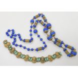 A Neiger Brothers Egyptian Revival bracelet, and a string of their lapis glass beads with decorative