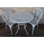 A 20th century white painted cast metal garden table and two chairs (3) Condition Report:Available