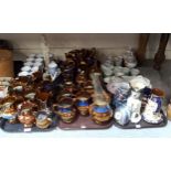 A quantity of copper lustre pottery jugs, blue chintz printed mugs, wally dog jug and other items