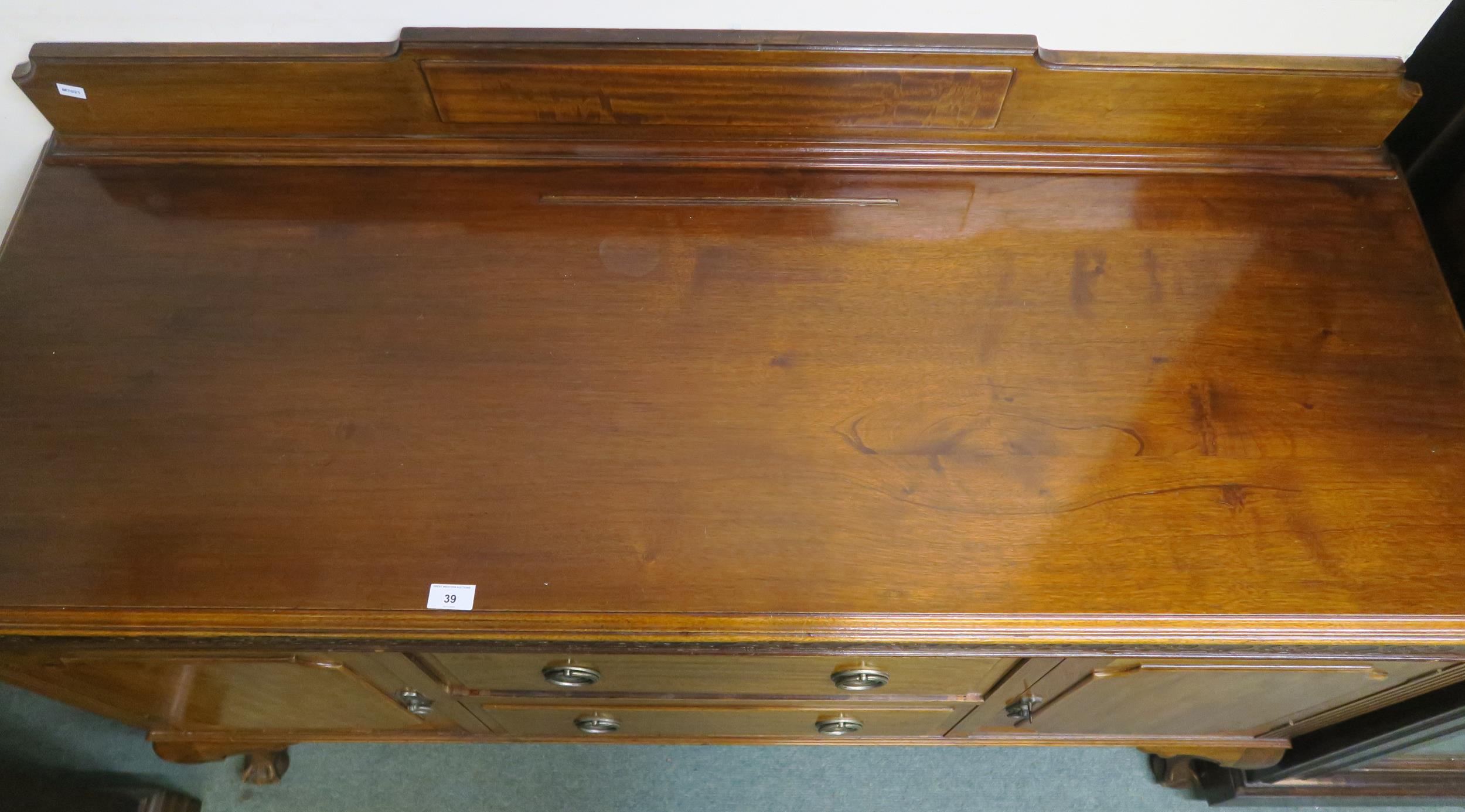 An early 20th century mahogany sideboard with two central drawers flanked by cabinet doors on - Image 3 of 7