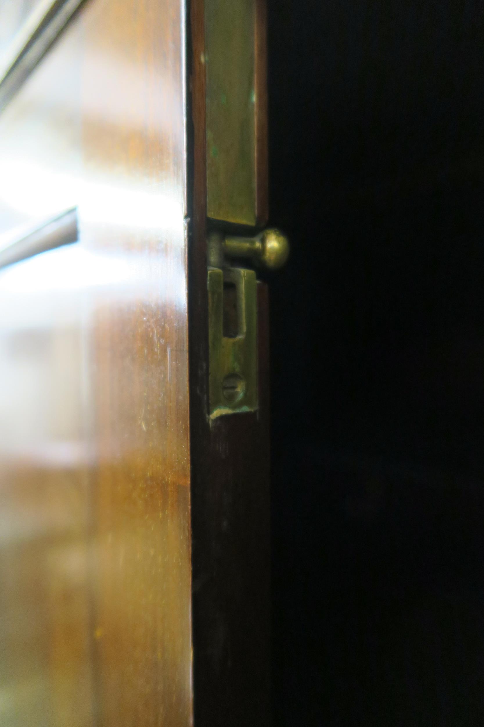 A 20th century mahogany wardrobe with moulded cornice over pair of panel doors on bracket base, - Image 5 of 6