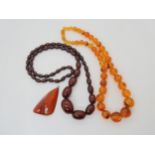 A cherry amber coloured bead necklace, an amber pendant weight 75.7gms, and a reconsituted amber