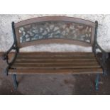 An early 20th century garden bench with cast ends and cast floral splat insert, 87cm high x 127cm