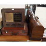 A 20th century mahogany cased Bush radio, portable Singer sewing machine, leather suitcase and a