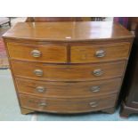 A Victorian mahogany bow front two over three chest of drawers on bracket feet, 99cm high x 115cm