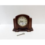 A Mahogany mantle clock, retailed by Davidson Henderson & Sorley, Glasgow Condition Report:Available