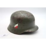 A WW2 German-style helmet, or Stahlhelm Condition Report:Available upon request