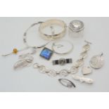 A silver topped pot, silver bangles, locket butterfly wing pendant and other items Condition