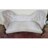 A Victorian mahogany framed double spoon backed parlour settee upholstered in silver velour with