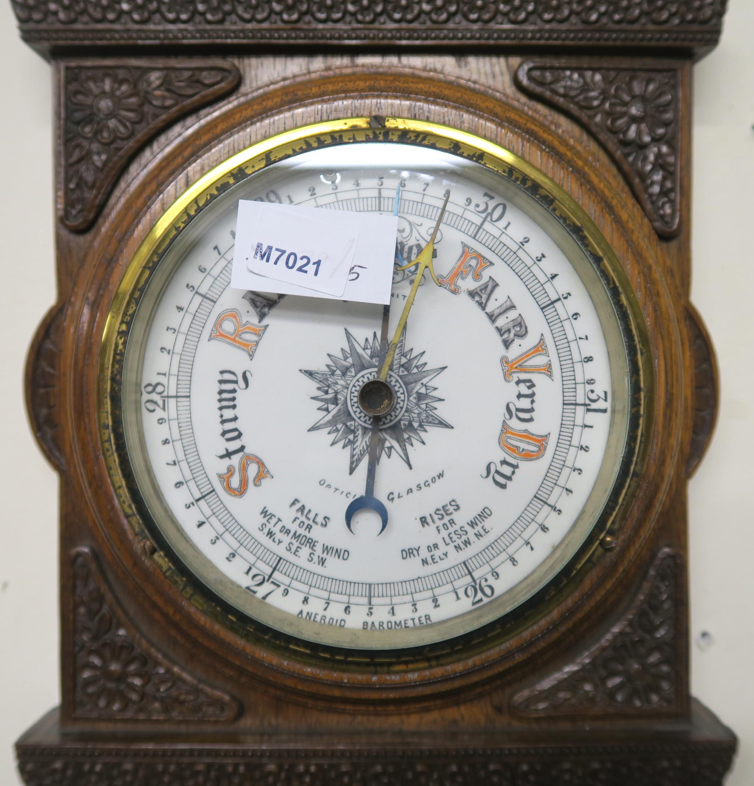 A 20th century carved oak barometer/thermometer and brass framed circular wall mirror (2) - Image 6 of 8