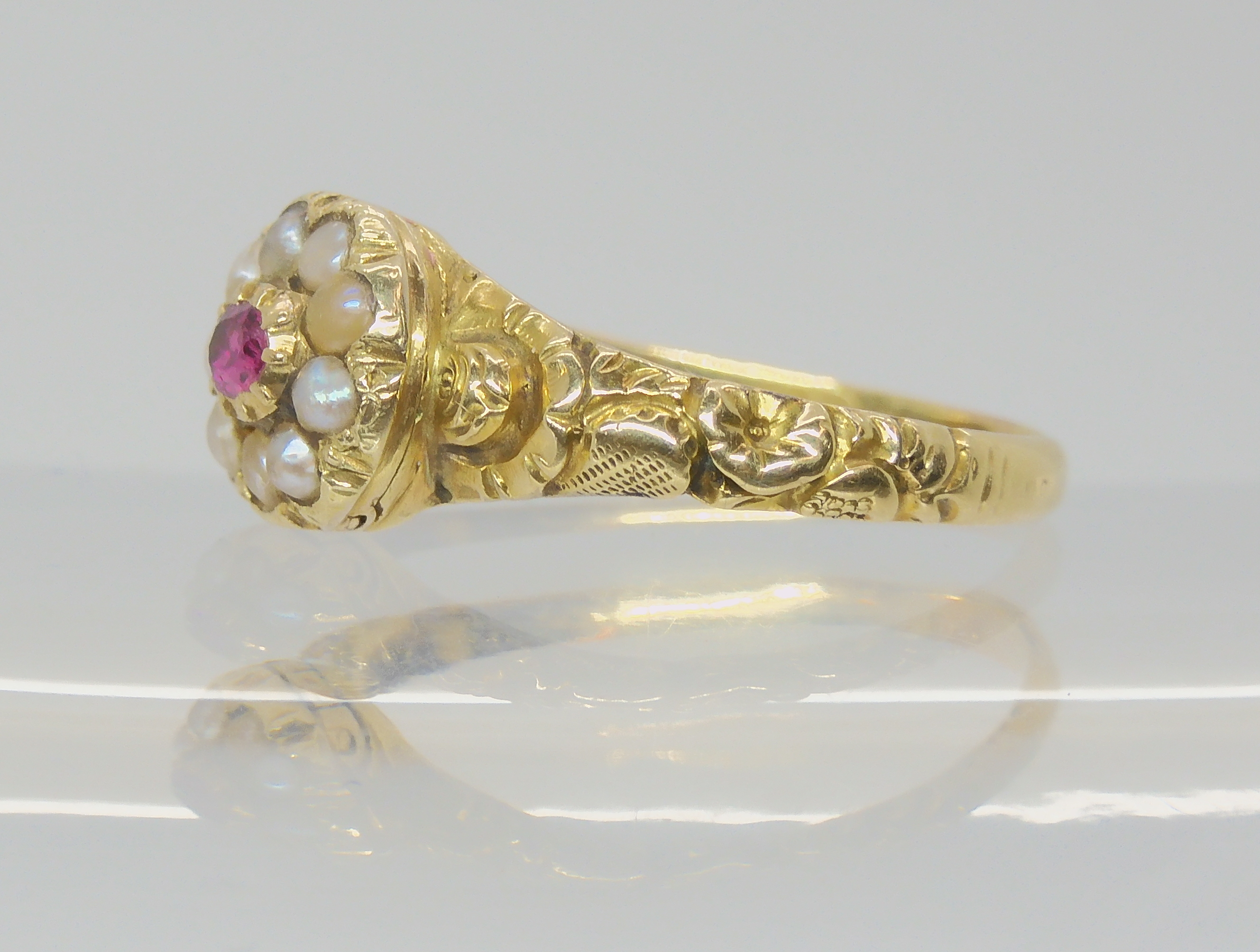 A Victorian locket ring, the hinged cover set with a ruby and pearls, with a yellow metal flower - Image 3 of 4