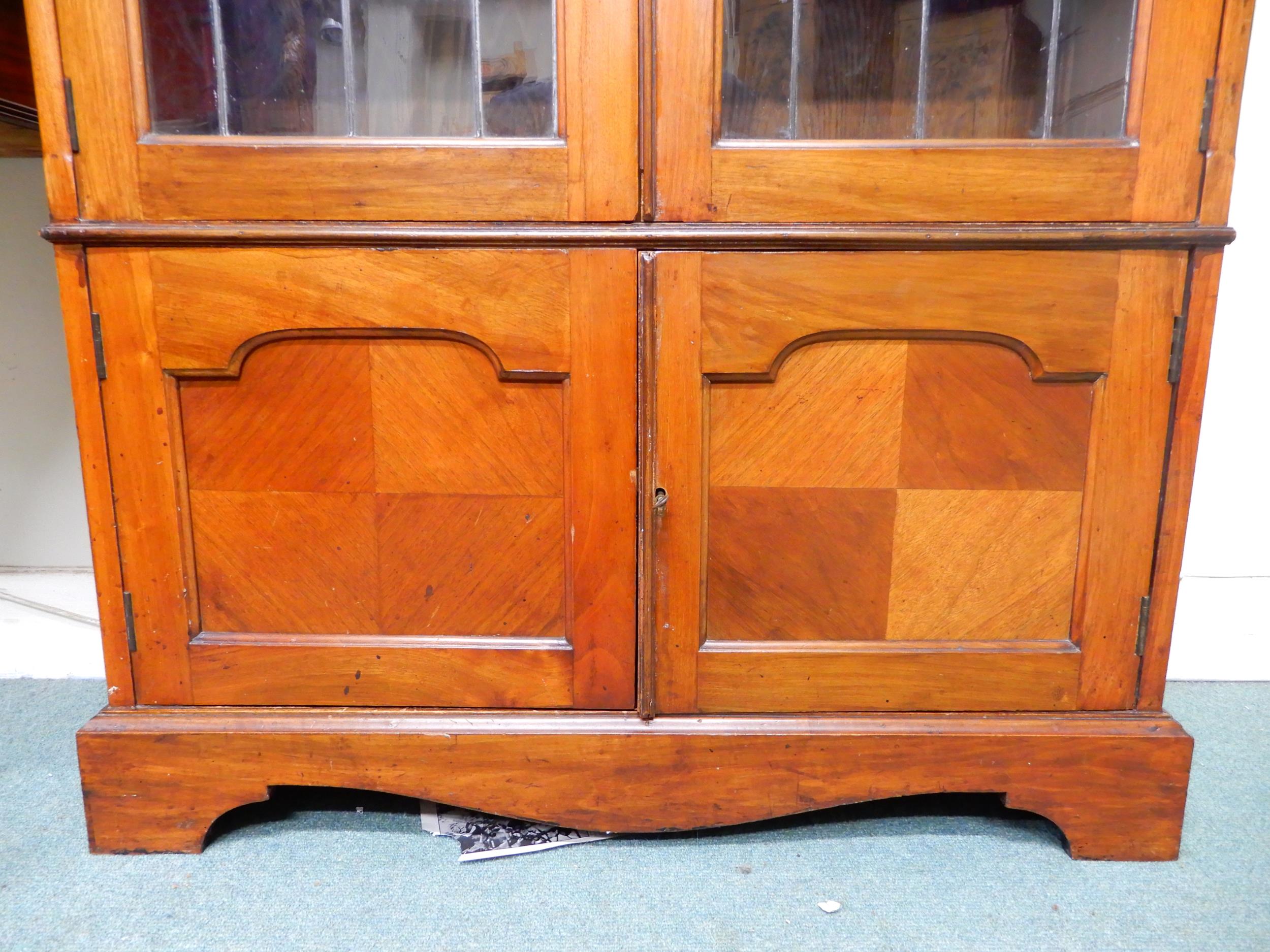 An early 20th century mahogany glazed bookcase with moulded cornice over pair of leaded glass - Image 3 of 5