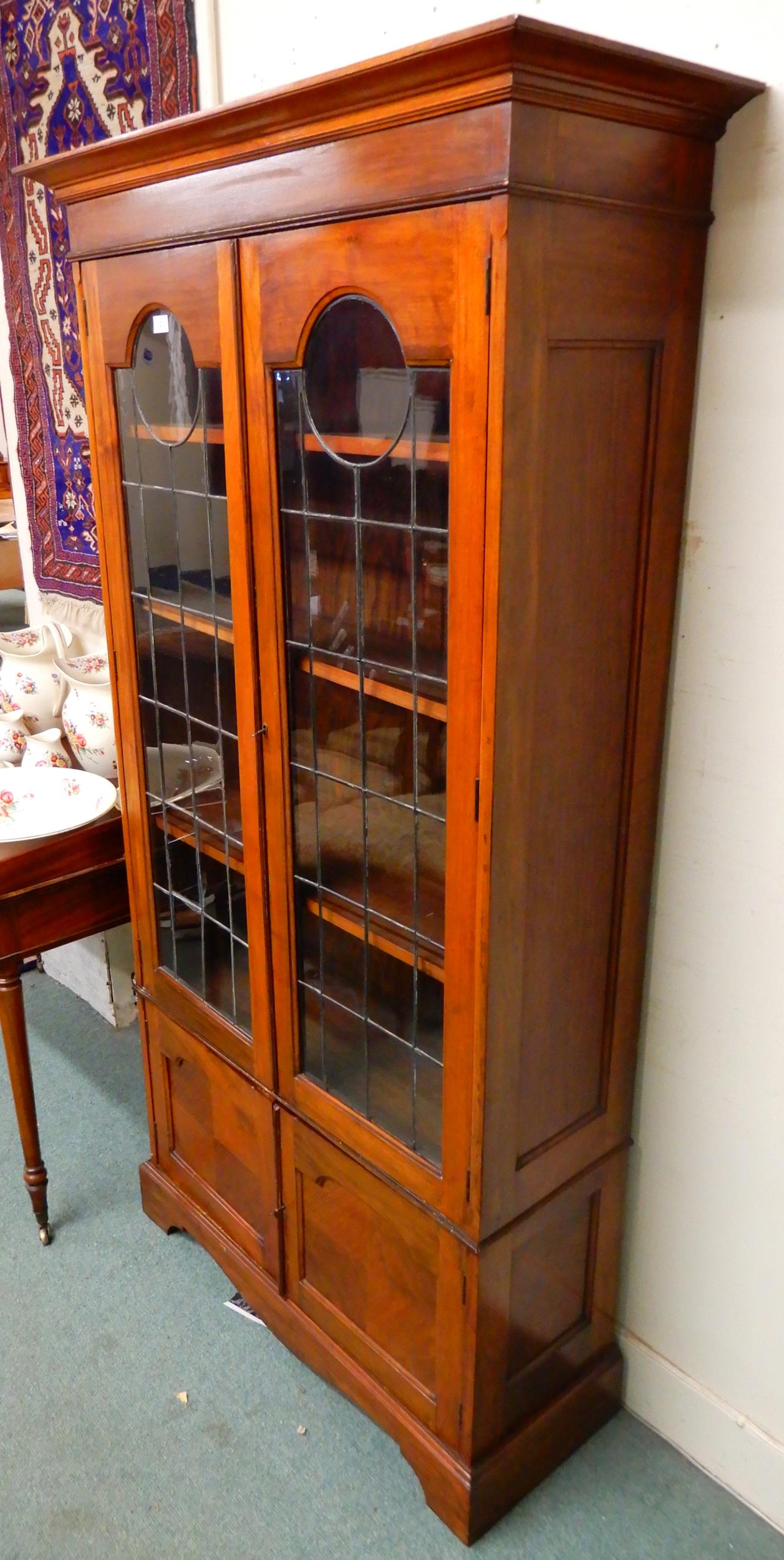 An early 20th century mahogany glazed bookcase with moulded cornice over pair of leaded glass - Image 5 of 5