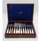 A cased set of Edwardian silver and mother of pearl fish knives and forks, the knives with pierced