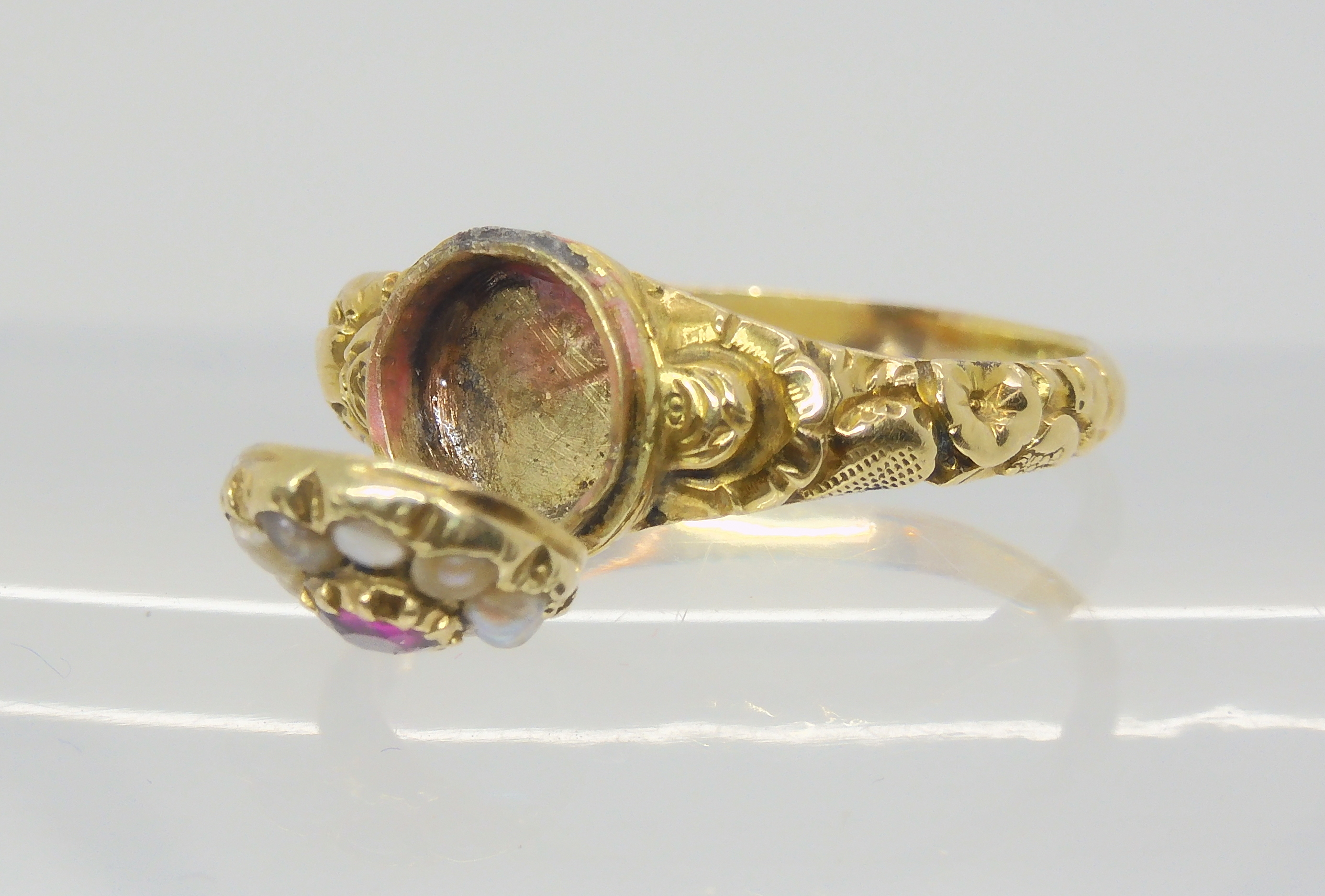 A Victorian locket ring, the hinged cover set with a ruby and pearls, with a yellow metal flower - Image 2 of 4