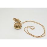 A 9ct gold mounted, highly decorative horse themed fob seal set with a smoky quartz, length 3cm,