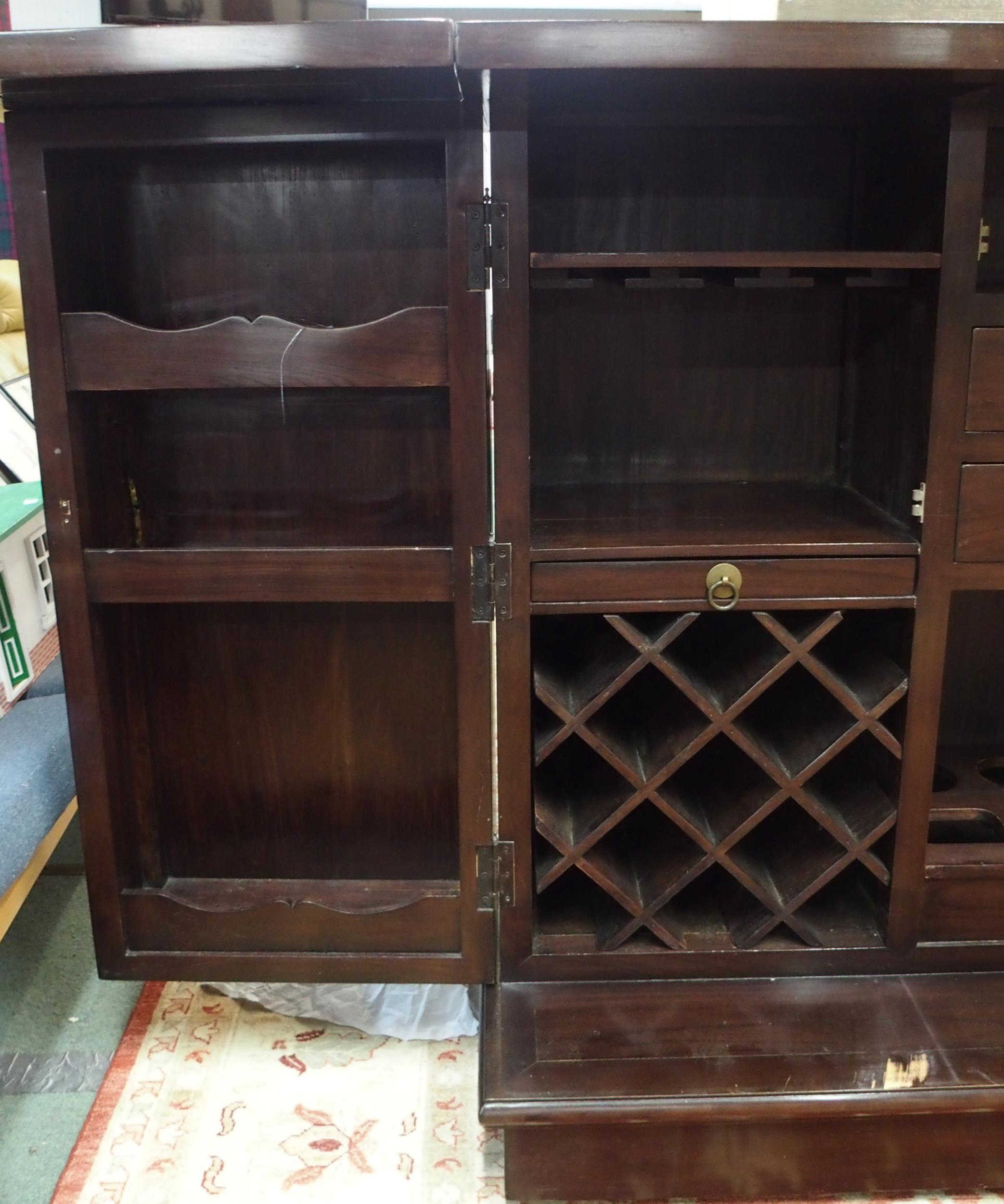 A 20th century Oriental hardwood drinks cabinet with pair of fold out top concealing marble insert - Image 4 of 8