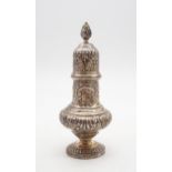 A late Victorian silver sugar caster, of baluster form, the bodies with embossed shellwork