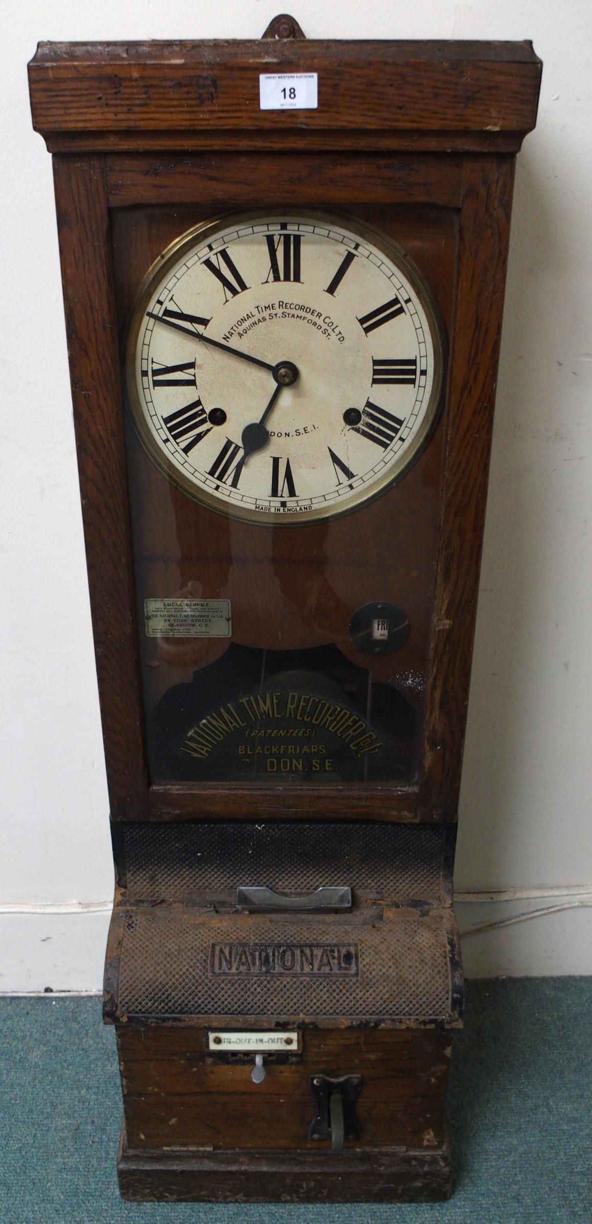 An early 20th century oak cased "National Time Recorder Co Ltd" clocking machine, 106cm high x