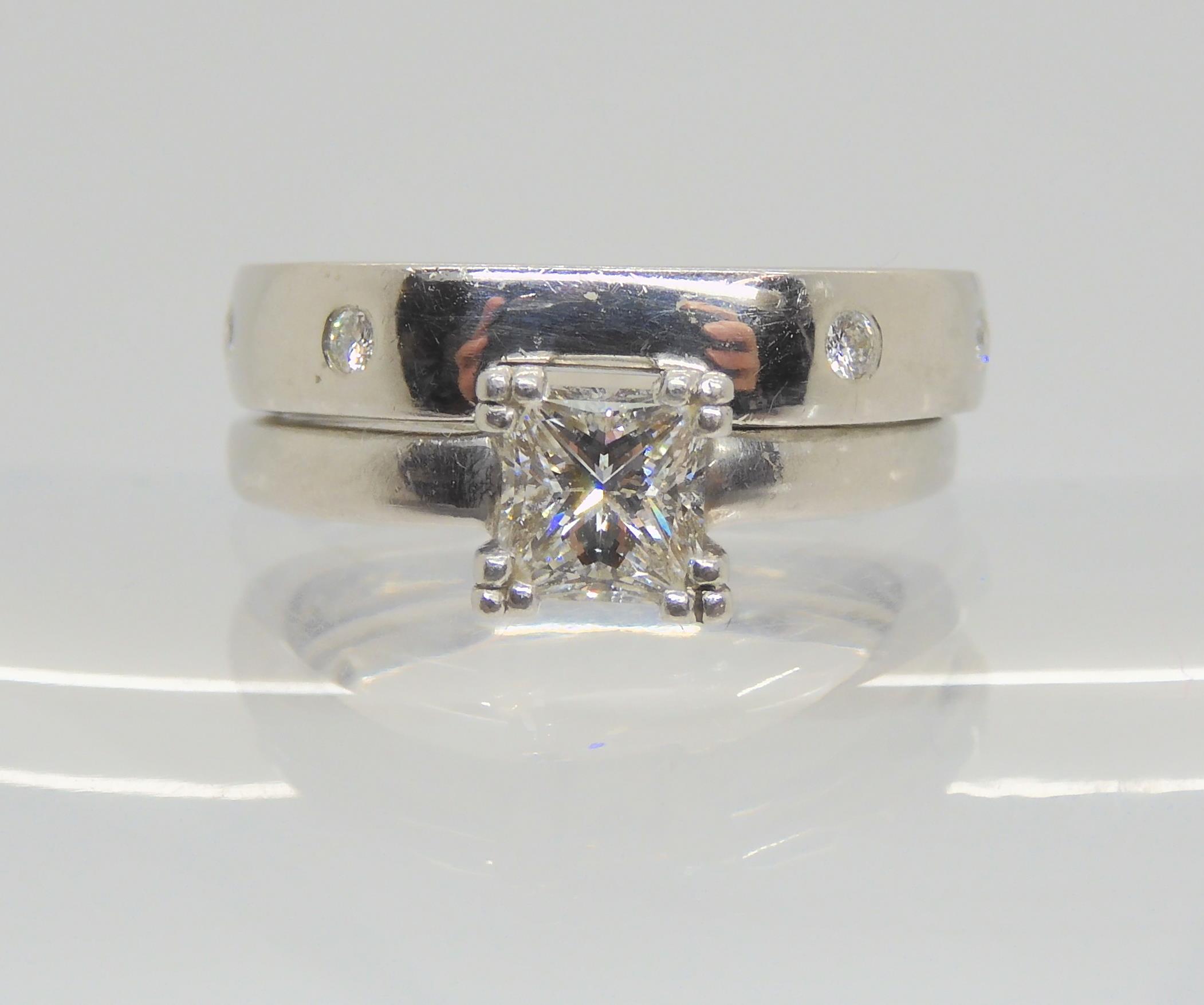 A platinum princess cut diamond solitaire of estimated approx 0.74ct  size O1/2 with shaped to fit