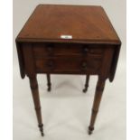 A Victorian mahogany two drawer drop side occasional table on turned supports terminating in brass