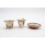 A silver sugar bowl and cream jug, with a shaped rim, on four out-swept shell feet, by Marson &