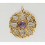 A bright yellow metal filligree work pendant set with amethyst and moonstone, diameter approx 3.2cm,