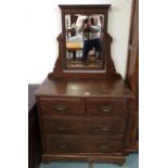 A late Victorian mahogany dressing chest with bevelled glass dressing mirror over two short over two