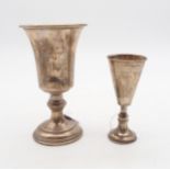 A silver goblet, on a footed circular base, with a knopped capstan stem, with presentational