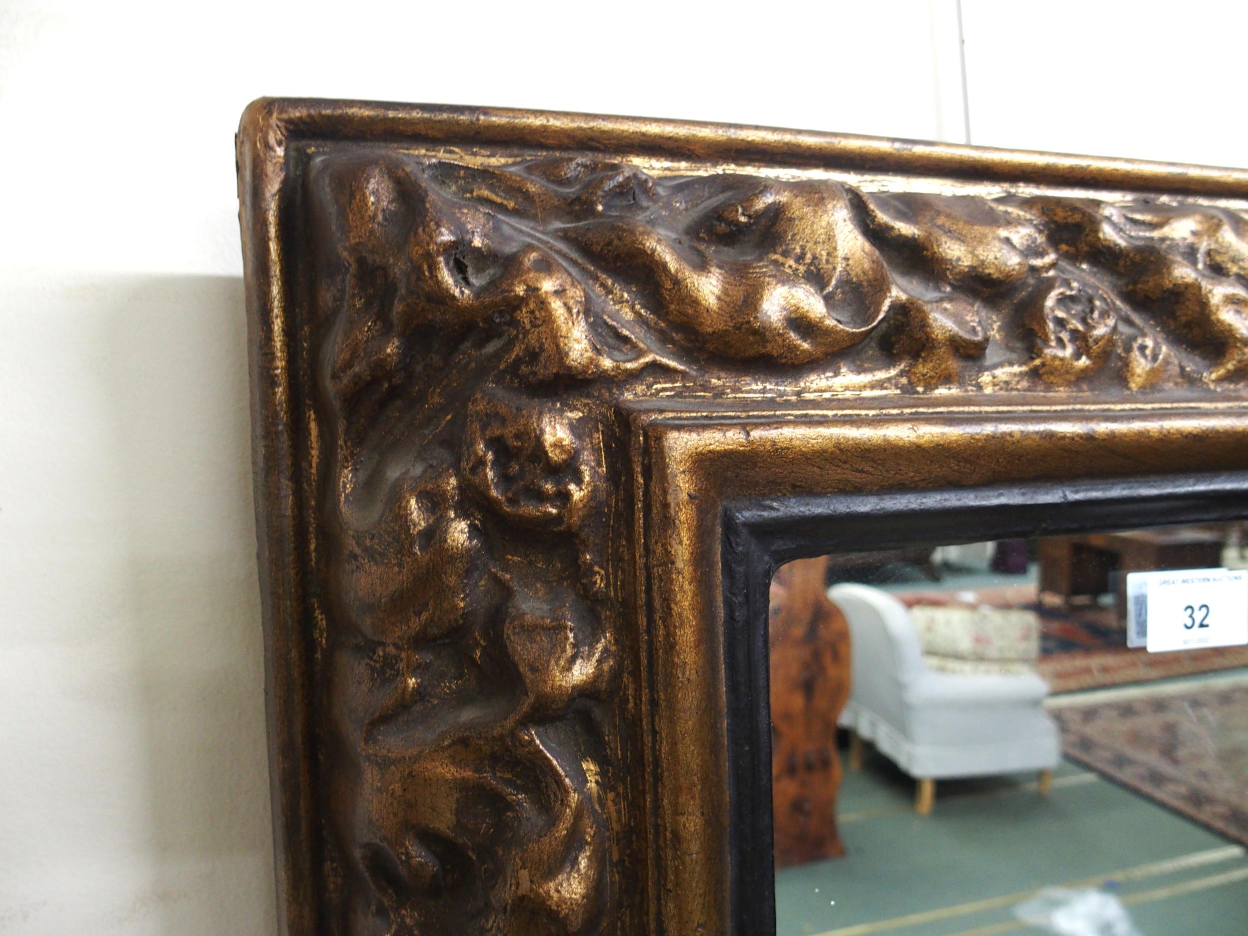 A 20th century gilt gesso style cushion framed wall mirror, 69cm high x 51cm wide and two walking - Image 2 of 4