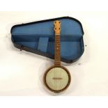 A banjolele with case Condition Report:Available upon request