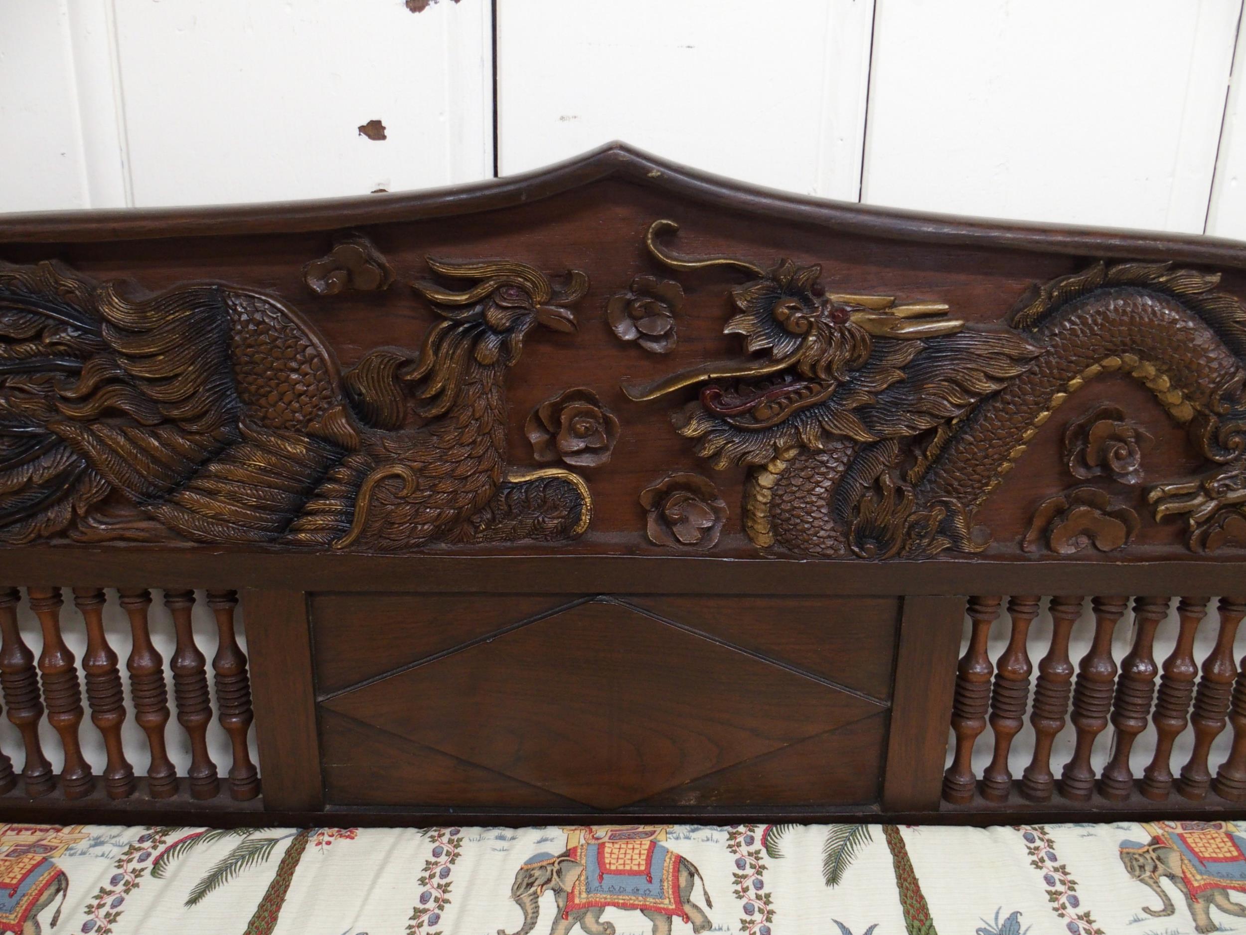 A contemporary Oriental hardwood day bed with carved back depicting phoenix and dragon over - Image 3 of 7