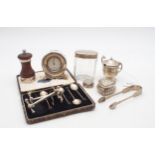 A collection of silver including a silver cased travelling clock, by William Comyns, London 1902,