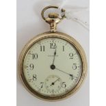 A gold plated Waltham pocket watch. Open face with cream dial, black Arabic numerals, with the