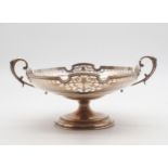 A George V silver comport, the borders with pierced naturalistic openwork, on a circular base, by