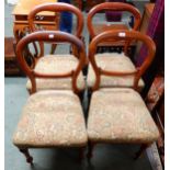 A set of four Victorian beech balloon back chairs on turned tapering supports (4) Please note this