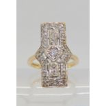 A 9ct gold diamond set plaque ring. Set with estimated approx 0.40cts of brilliant cut diamonds,