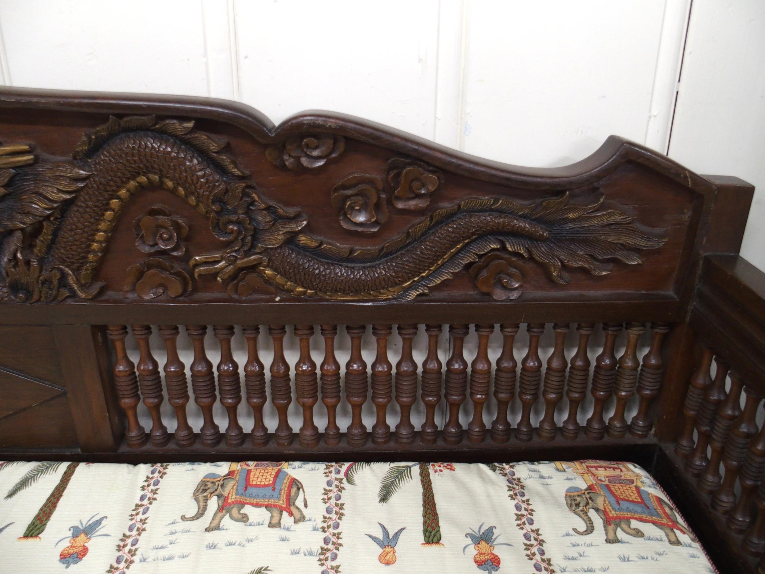 A contemporary Oriental hardwood day bed with carved back depicting phoenix and dragon over - Image 2 of 7