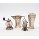 A collection of silver including an Art Deco silver cream jug and caster, on stepped circular bases,