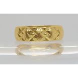 An 18ct gold bright cut decorated wedding ring, size Q, weight 3.6gms Condition Report:Available