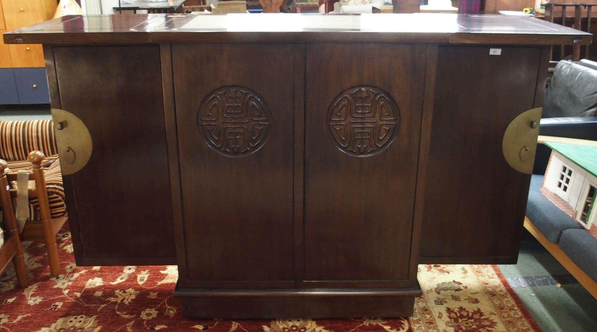 A 20th century Oriental hardwood drinks cabinet with pair of fold out top concealing marble insert - Image 6 of 8