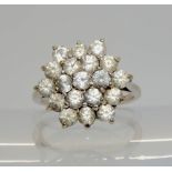 An 18ct gold clear gem cluster ring, size N1/2, weight 5.6gms Condition Report:Available upon