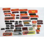 A quantity of 00-Gauge model railway locomotives and stock, largely by Hornby and Tri-ang, many