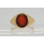 A heavy weight 9ct gold gents carnelian signet ring, size V, weight 8.6gms Condition Report:Inner