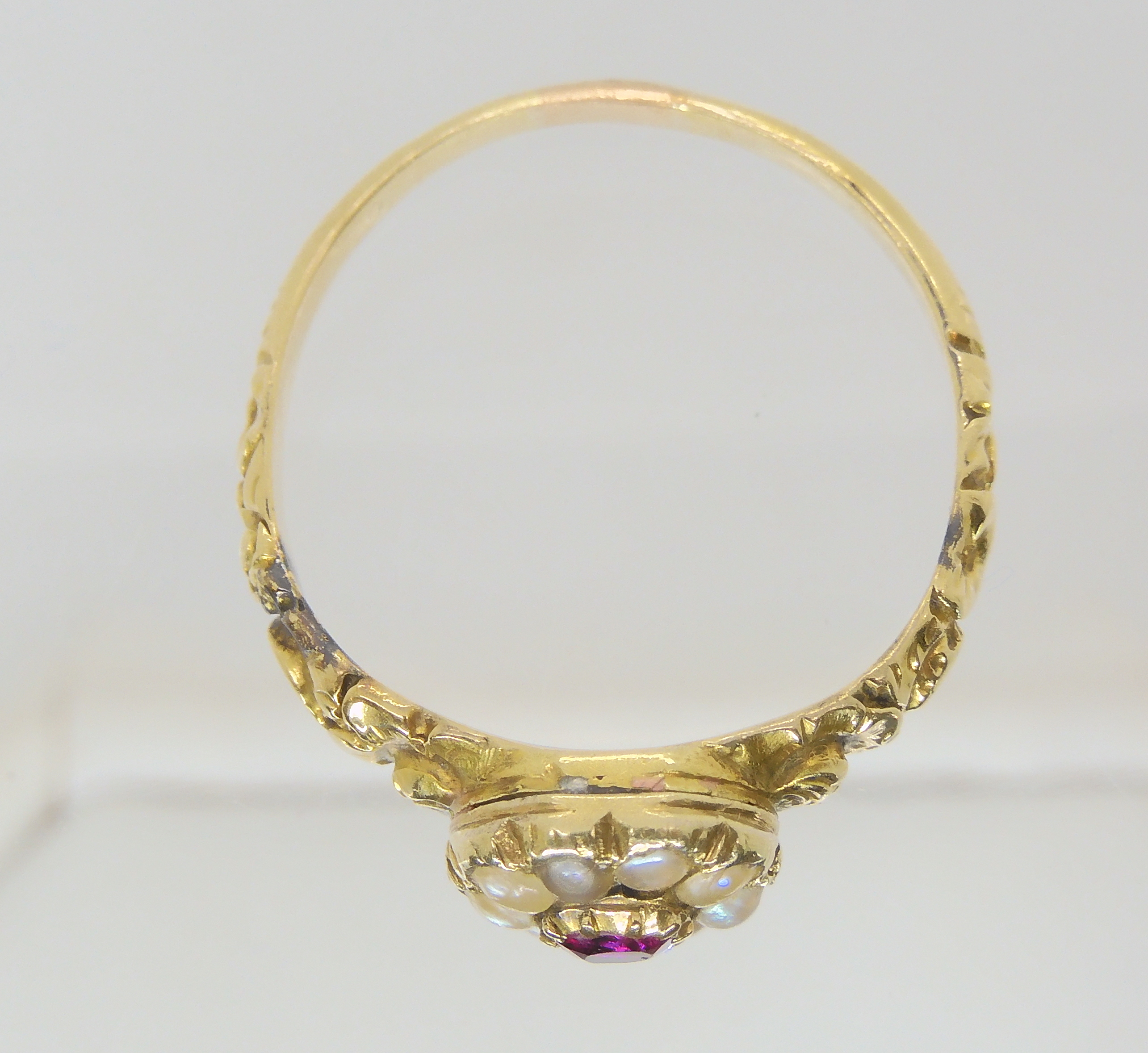 A Victorian locket ring, the hinged cover set with a ruby and pearls, with a yellow metal flower - Image 4 of 4