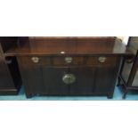 A 20th century Oriental hardwood sideboard with scroll end top over three drawers over pair of