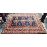 A dark blue ground Pakistani super Garous rug with three geometric medallions and multicoloured